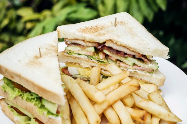 club sandwich snack with french fries on plate